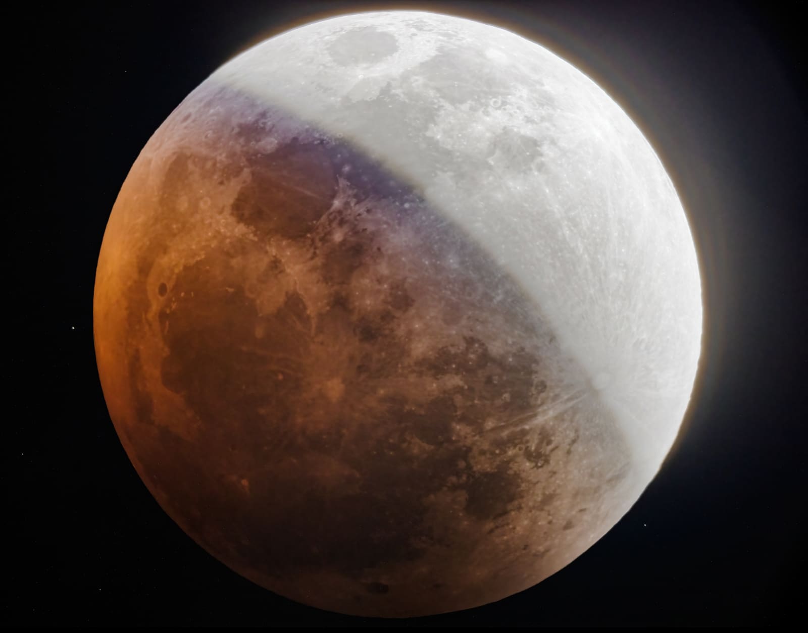 A moon split almost evenly between a bright white lit half and a deep red shadowed half during the September 2025 total lunar eclipse.